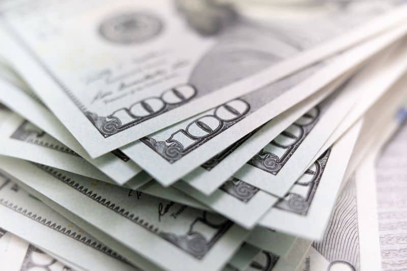 stack of dollars spread out stack of dollars spread out
