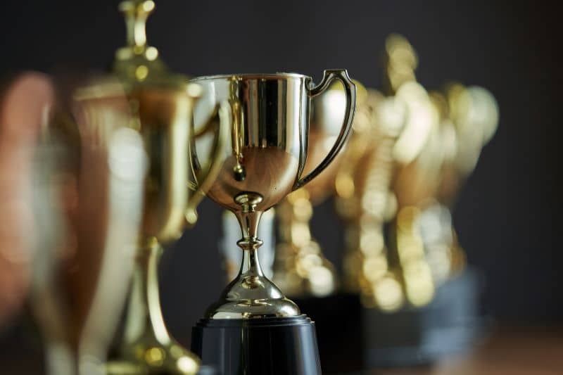 group of trophies in a row group of trophies in a row