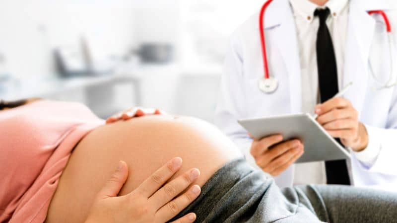 Pregnant Woman and Gynecologist Doctor at Hospital Pregnant Woman and Gynecologist Doctor at Hospital