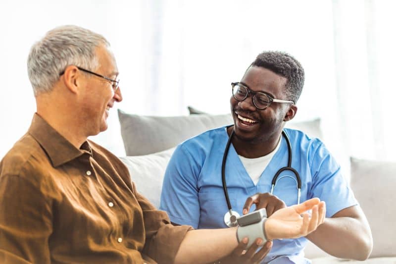 Male nurse visits patients at his residence. Male nurse visits patients at his residence.
