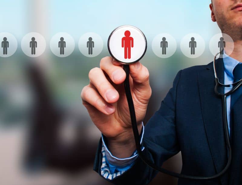 Businessman hand with stethoscope Businessman hand with stethoscope